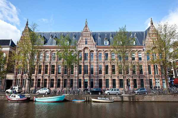 Iconic Amsterdam canal view, symbolizing the city's blend of historic charm and academic vibrancy