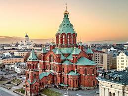 A picturesque view of Helsinki, showcasing its harmonious blend of historical architecture and modern educational facilities, set against the backdrop of Finland's natural beauty