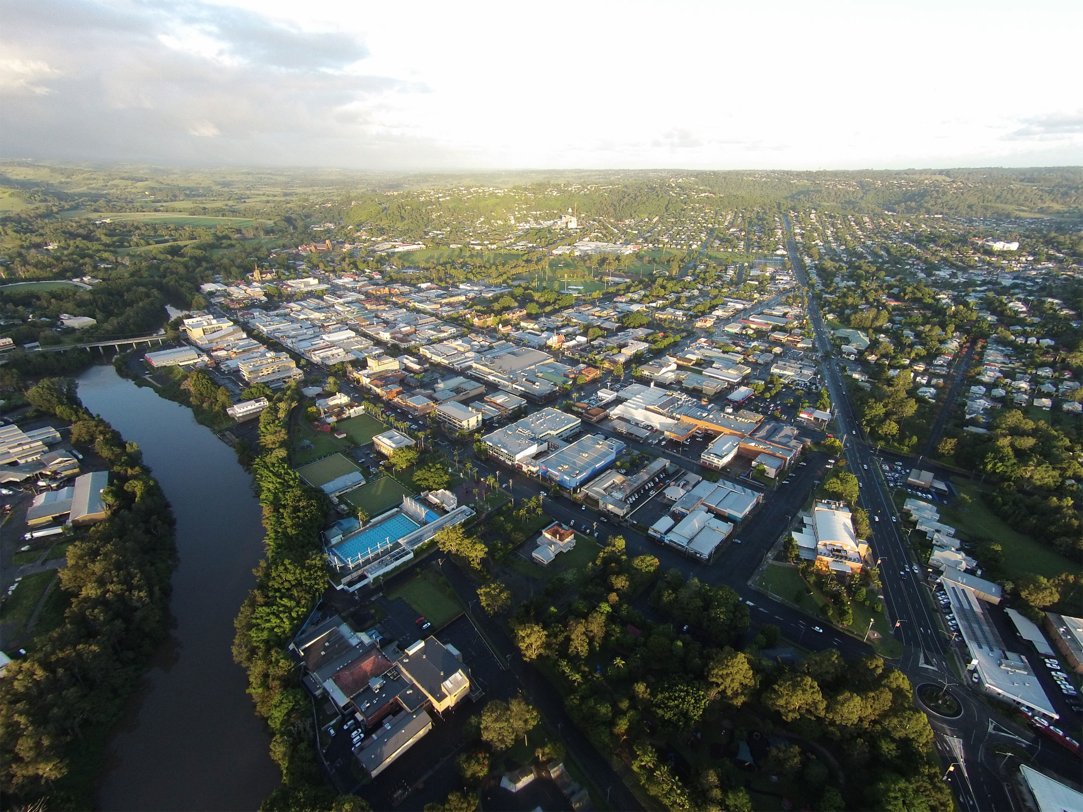 Academic Jobs Lismore, Australia - Cityscape overlooking lush greenery and buildings