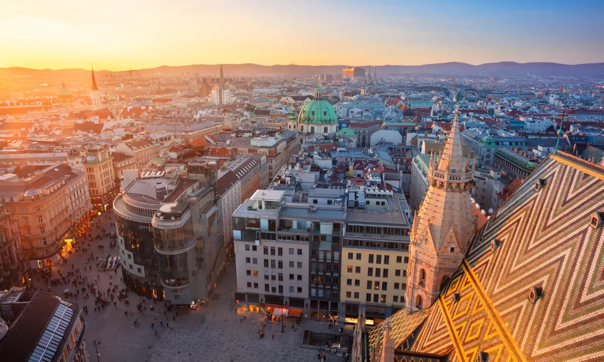 The historic architecture of Vienna's universities set against the city's skyline, symbolizing the blend of traditional and modern educational values